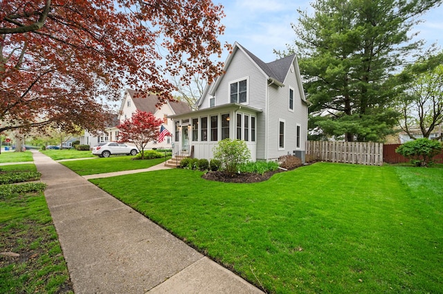 view of property exterior featuring a sunroom