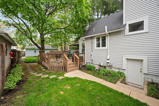 view of yard featuring a wooden deck