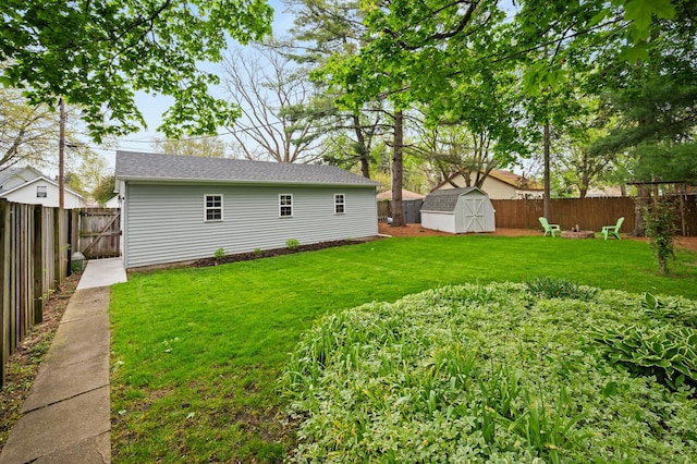 view of yard featuring an outbuilding and a storage shed