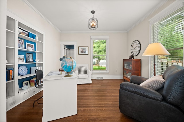 office space featuring crown molding, wood finished floors, baseboards, and built in features
