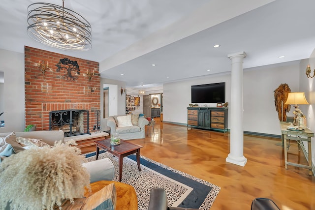 living room with decorative columns, a fireplace, baseboards, wood finished floors, and recessed lighting