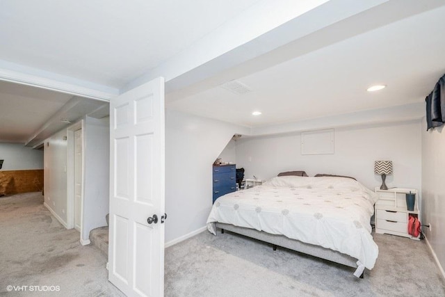 carpeted bedroom featuring baseboards and recessed lighting