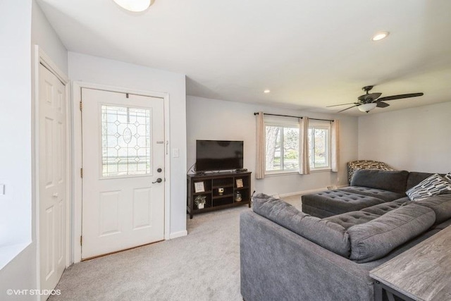 living area with recessed lighting, baseboards, light carpet, and ceiling fan