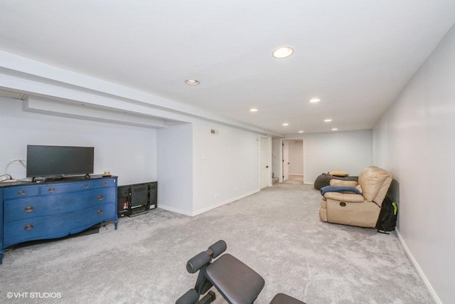 exercise area featuring recessed lighting, baseboards, and light colored carpet