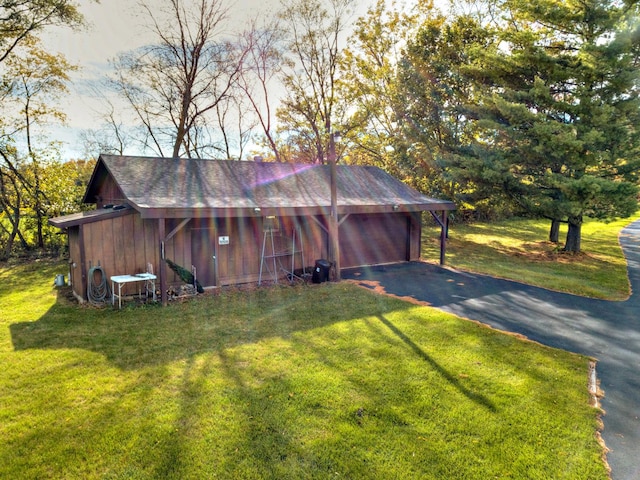 4508 Mccauley Rd, Woodstock, IL 60098 - view of home's exterior with a lawn and a detached garage