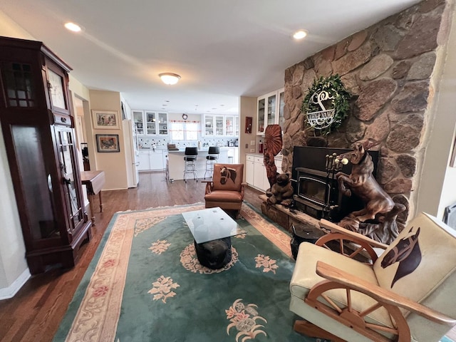 4508 Mccauley Rd, Woodstock, IL 60098 - living area featuring dark wood-style flooring and a wood stove