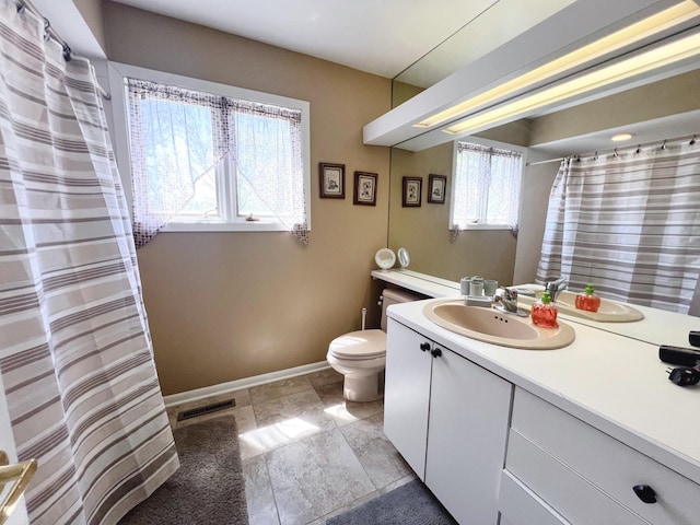 4508 Mccauley Rd, Woodstock, IL 60098 - full bathroom with baseboards, vanity, and toilet
