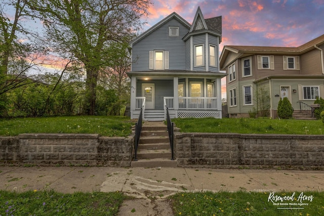 837 S 4th Ave, Kankakee, IL 60901 - victorian house with a front lawn and a porch