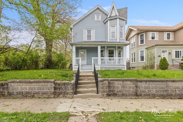 837 S 4th Ave, Kankakee, IL 60901 - victorian-style house with covered porch and a front lawn