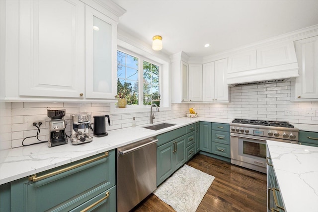 946 N Marion St, Oak Park, IL 60302 - kitchen featuring appliances with stainless steel finishes, a sink, white cabinetry, and recessed lighting