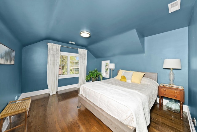 946 N Marion St, Oak Park, IL 60302 - bedroom with baseboards, wood finished floors, lofted ceiling, and a baseboard heating unit