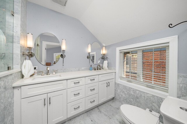 946 N Marion St, Oak Park, IL 60302 - full bathroom with vaulted ceiling, double vanity, toilet, and tile walls