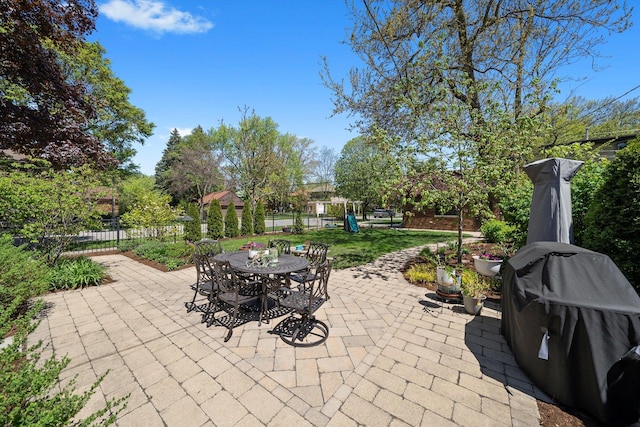946 N Marion St, Oak Park, IL 60302 - view of patio with fence, outdoor dining area, and a grill