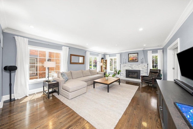 946 N Marion St, Oak Park, IL 60302 - living area featuring ornamental molding, dark wood-type flooring, a glass covered fireplace, recessed lighting, and baseboards