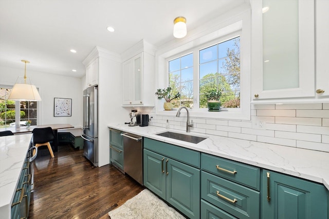 946 N Marion St, Oak Park, IL 60302 - kitchen featuring a sink, stainless steel appliances, white cabinets, healthy amount of natural light, and recessed lighting