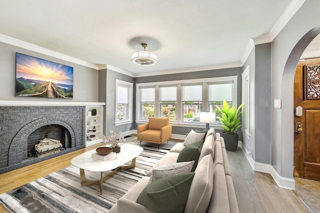5824 N Fairfield Ave, Chicago, IL 60659 - living room featuring arched walkways, baseboards, crown molding, and wood finished floors