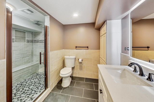 5824 N Fairfield Ave, Chicago, IL 60659 - full bathroom with tile walls, toilet, visible vents, tile patterned flooring, and a shower stall