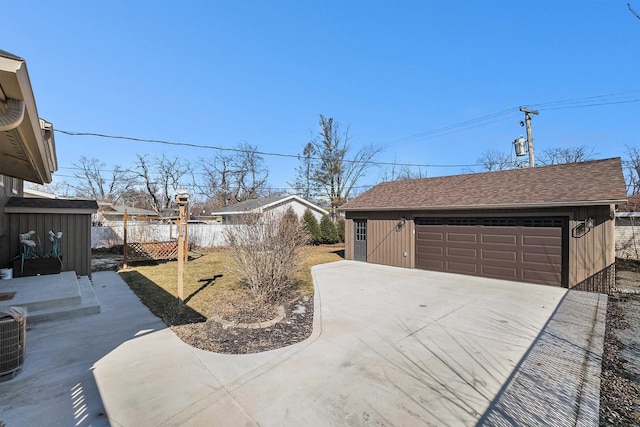 view of yard with an outbuilding and a garage