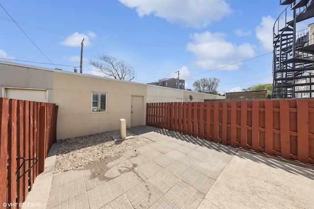 view of patio / terrace featuring fence