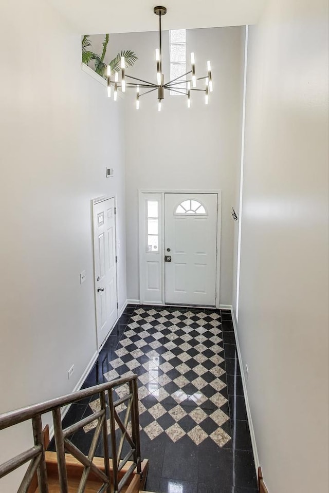 1214 N Marion Ct Unit A, Chicago, IL 60622 - foyer entrance featuring a chandelier, a high ceiling, and dark flooring