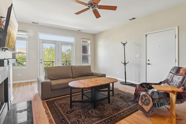 4122 S Vincennes Ave Unit 3N, Chicago, IL 60653 - living room with wood finished floors, ceiling fan, a fireplace with flush hearth, and baseboards
