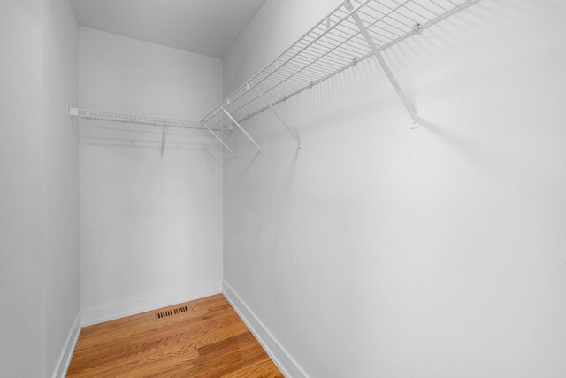 20445 Spirea Ln, Crest Hill, IL 60403 - spacious closet with visible vents and wood finished floors