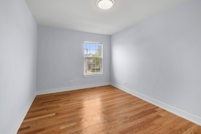 20445 Spirea Ln, Crest Hill, IL 60403 - spare room featuring light wood-style flooring and baseboards