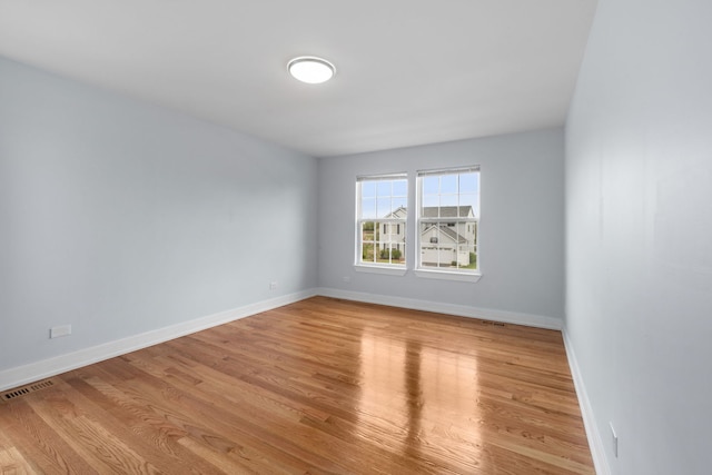 20445 Spirea Ln, Crest Hill, IL 60403 - unfurnished room with baseboards, visible vents, and wood finished floors