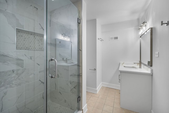 20445 Spirea Ln, Crest Hill, IL 60403 - bathroom featuring vanity, visible vents, tile patterned floors, a stall shower, and baseboards