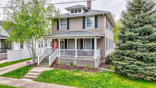 621 Marcy St, Ottawa, IL 61350 - american foursquare style home featuring a porch, a chimney, a shingled roof, and a front lawn