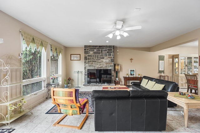 living room with ceiling fan, a wealth of natural light, and recessed lighting