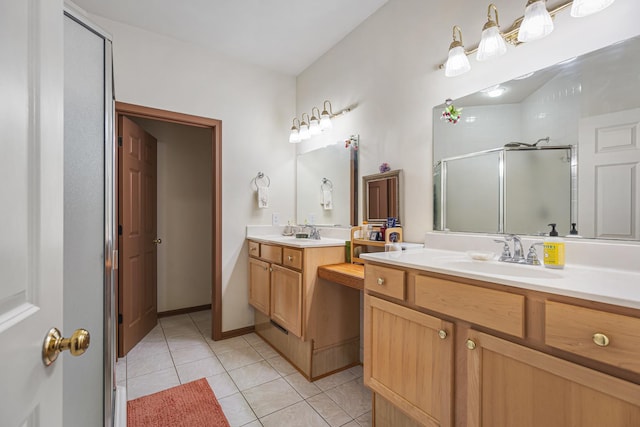bathroom featuring a stall shower, two vanities, a sink, and tile patterned floors