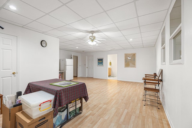 interior space featuring recessed lighting, baseboards, a ceiling fan, and light wood-style floors