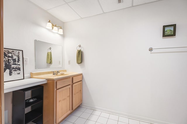 bathroom with tile patterned flooring, baseboards, visible vents, and vanity