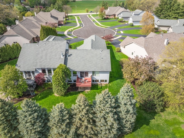 birds eye view of property with a residential view