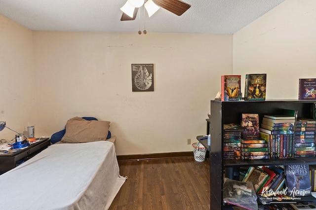 bedroom featuring a ceiling fan and wood finished floors