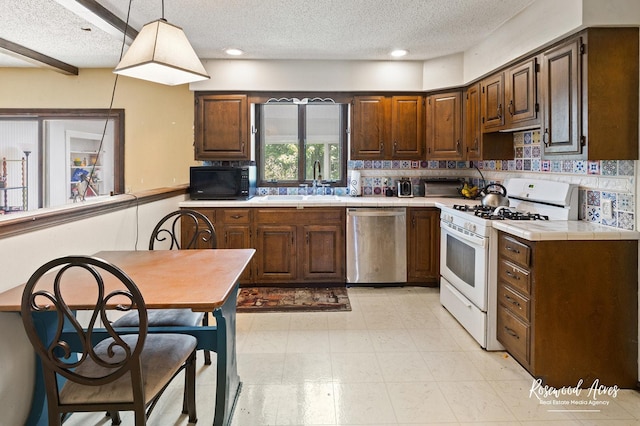 kitchen with dishwasher, a textured ceiling, black microwave, and white range with gas stovetop