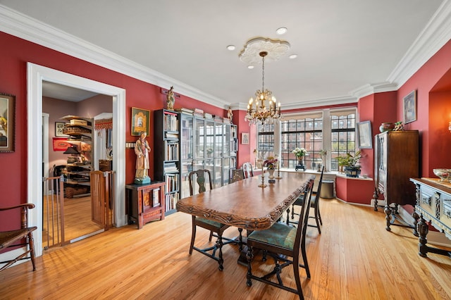 3800 N Lake Shore Dr Unit 5E, Chicago, IL 60613 - dining area with an inviting chandelier, light wood-style flooring, and ornamental molding