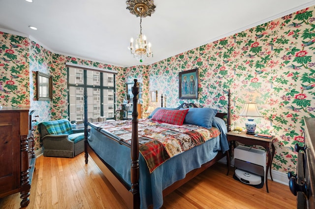 3800 N Lake Shore Dr Unit 5E, Chicago, IL 60613 - bedroom featuring a notable chandelier, crown molding, wallpapered walls, and wood finished floors