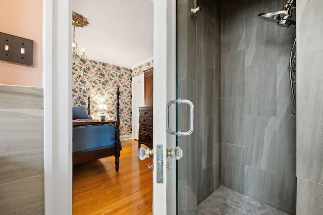 3800 N Lake Shore Dr Unit 5E, Chicago, IL 60613 - full bath featuring wallpapered walls, wood finished floors, a shower stall, and crown molding