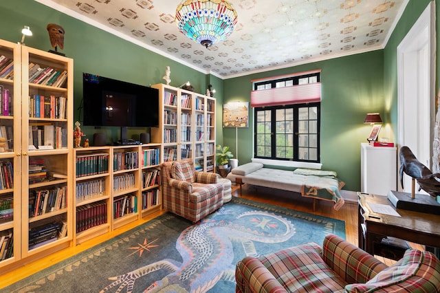 3800 N Lake Shore Dr Unit 5E, Chicago, IL 60613 - sitting room featuring crown molding, wood finished floors, and baseboards