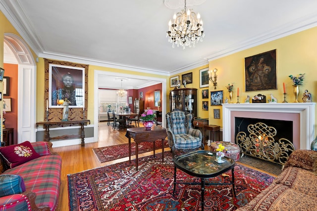 3800 N Lake Shore Dr Unit 5E, Chicago, IL 60613 - living area featuring an inviting chandelier, wood finished floors, baseboards, and crown molding