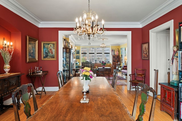 3800 N Lake Shore Dr Unit 5E, Chicago, IL 60613 - dining room with ornamental molding, a notable chandelier, baseboards, and wood finished floors