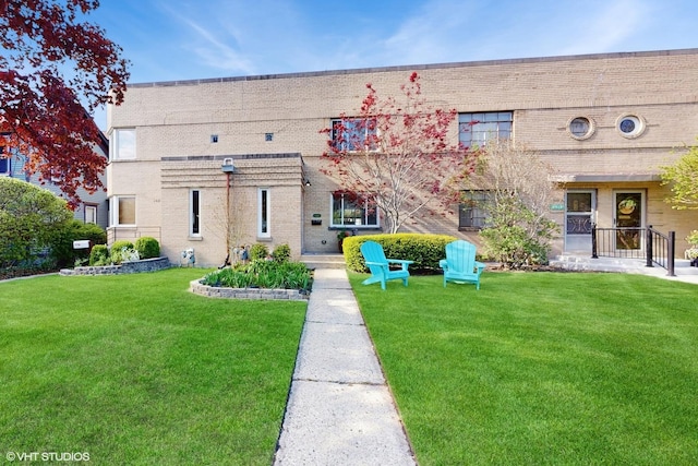 1421 Main St Unit 1421, Evanston, IL 60202 - view of front of home featuring brick siding and a front yard
