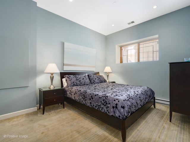 bedroom with baseboards, recessed lighting, baseboard heating, and visible vents