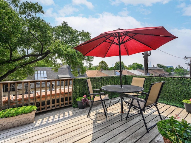 deck with outdoor dining area