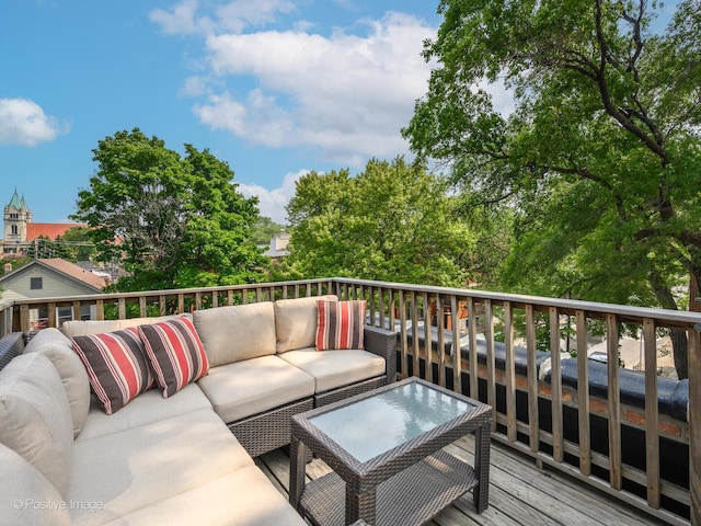 wooden terrace featuring outdoor lounge area