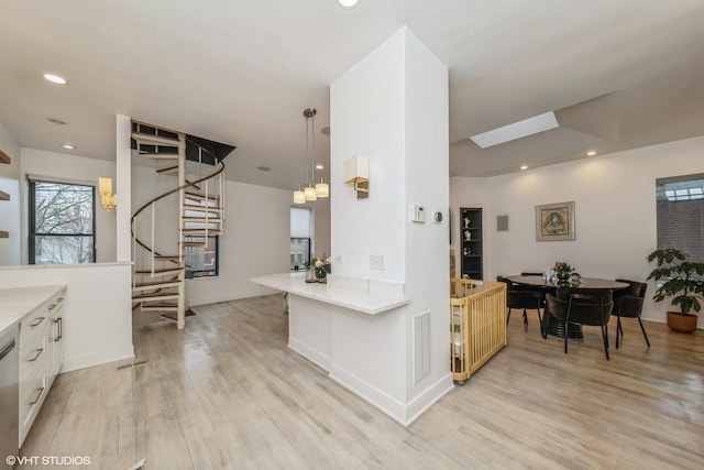 kitchen featuring light countertops, light wood-style floors, visible vents, and recessed lighting