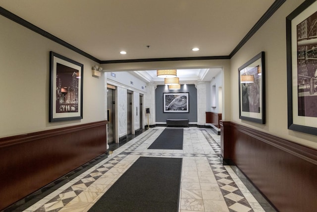 corridor with a wainscoted wall, ornamental molding, and recessed lighting