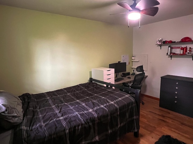 bedroom featuring ceiling fan and wood finished floors